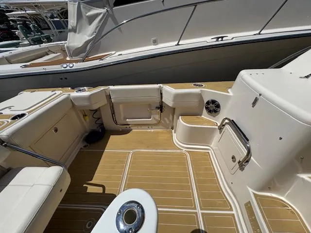  Yacht Photos Pics 2022 Grady-White Express 370 boat deck with seating and storage compartments.