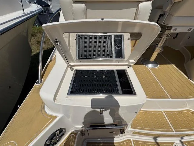  Yacht Photos Pics 2022 Grady-White Express 370 boat grill on deck, open lid, teak flooring.