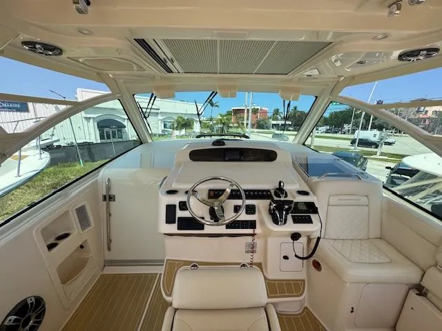  Yacht Photos Pics Interior of 2022 Grady-White Express 370 boat, featuring helm and seating area.