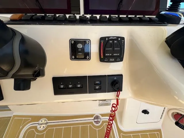  Yacht Photos Pics Control panel of 2022 Grady-White Express 370 boat with switches and gauges.