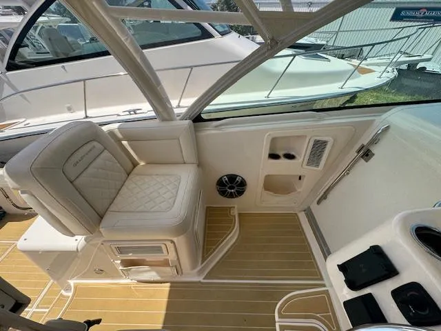  Yacht Photos Pics 2022 Grady-White Express 370 boat interior with cushioned seating and teak flooring.