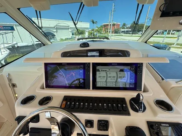  Yacht Photos Pics 2022 Grady-White Express 370 helm with dual navigation screens and control panel.