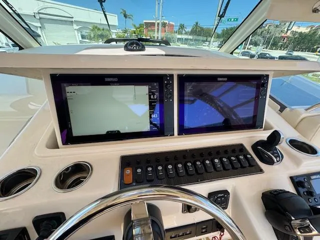  Yacht Photos Pics Helm of 2022 Grady-White Express 370 with dual Simrad displays and control panel.