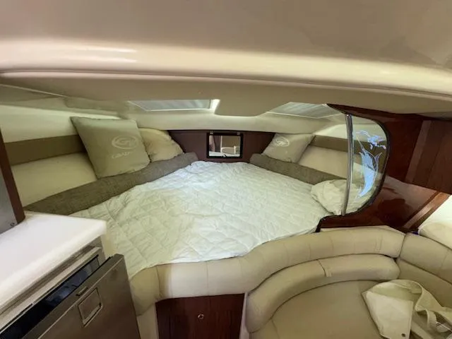  Yacht Photos Pics Luxurious cabin interior of 2022 Grady-White Express 370 boat with cozy bedding.