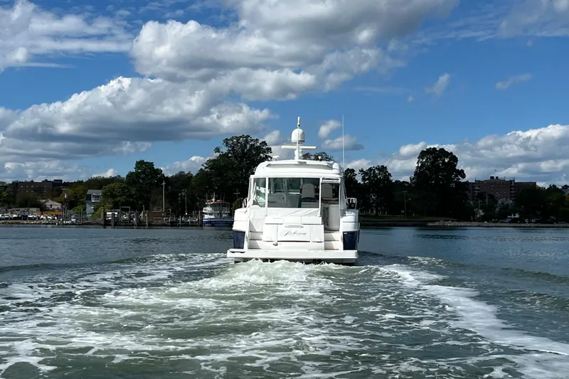 Dolcinea Yacht Photos Pics 2010 Cruisers Yachts 520 Sports Coupe sailing on a sunny day.