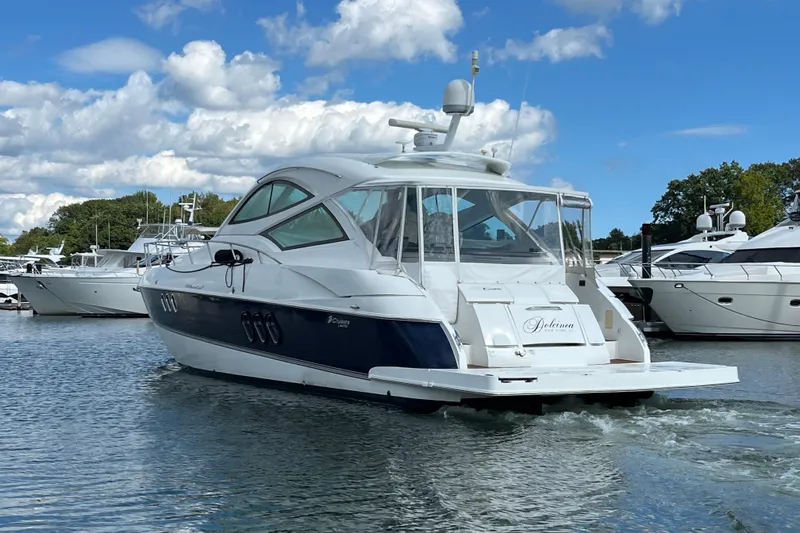 Dolcinea Yacht Photos Pics 2010 Cruisers Yachts 520 Sports Coupe on water, surrounded by other boats.