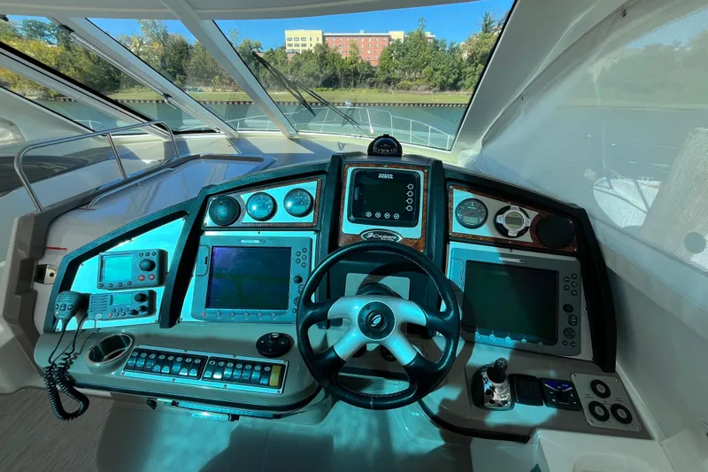 Dolcinea Yacht Photos Pics Cockpit of 2010 Cruisers Yachts 520 Sports Coupe with advanced navigation controls.