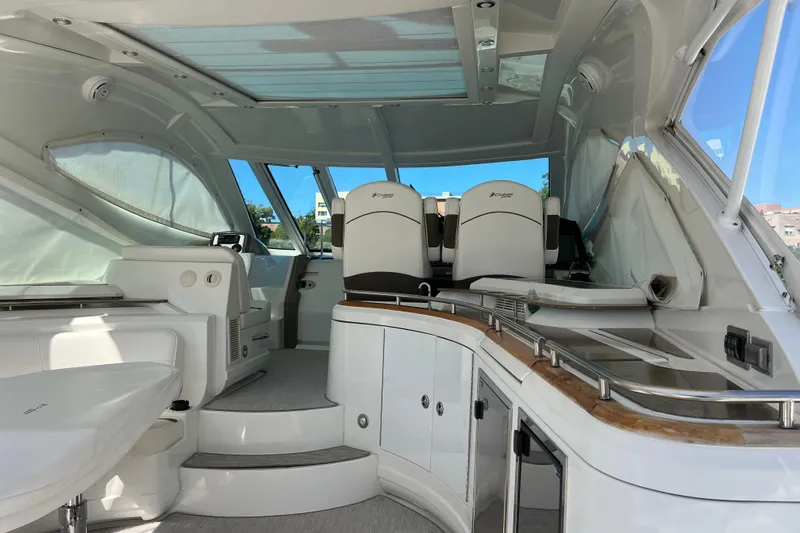 Dolcinea Yacht Photos Pics Interior of 2010 Cruisers Yachts 520 Sports Coupe, featuring sleek seating and modern design.