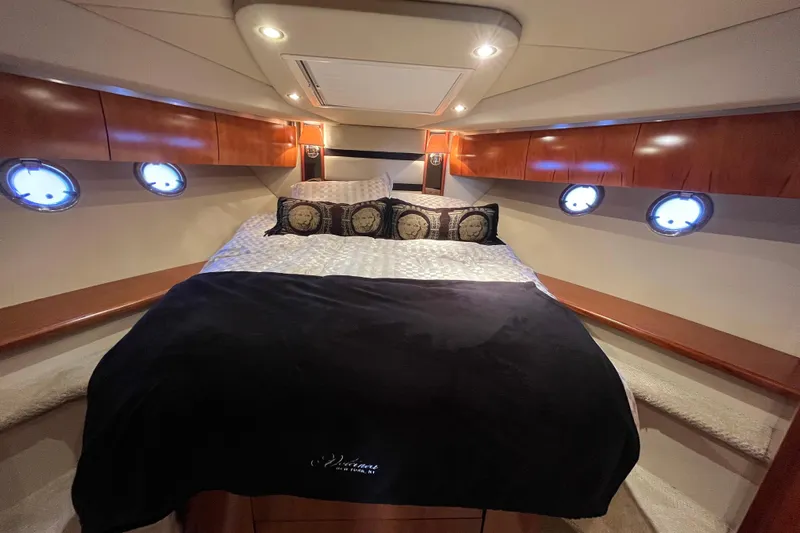 Dolcinea Yacht Photos Pics Luxurious cabin interior of 2010 Cruisers Yachts 520 Sports Coupe with elegant bedding.