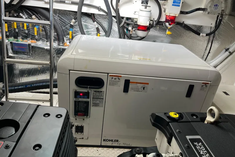 Dolcinea Yacht Photos Pics Engine room of 2010 Cruisers Yachts 520 Sports Coupe with Kohler generator.