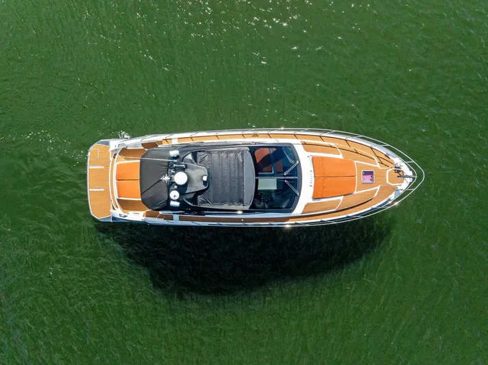 Po-sea-tive Vibez Yacht Photos Pics Aerial view of 2013 Azimut Atlantis 48 yacht on green water.