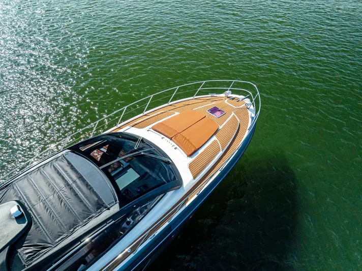 Po-sea-tive Vibez Yacht Photos Pics Azimut Atlantis 48 yacht, 2013 model, cruising on clear green water.