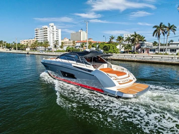 Po-sea-tive Vibez Yacht Photos Pics Azimut Atlantis 48 yacht cruising near a city waterfront, 2013 model.