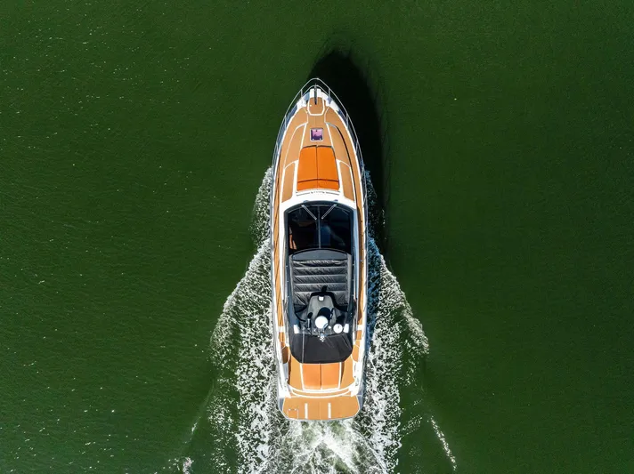 Po-sea-tive Vibez Yacht Photos Pics Aerial view of 2013 Azimut Atlantis 48 yacht cruising on green water.