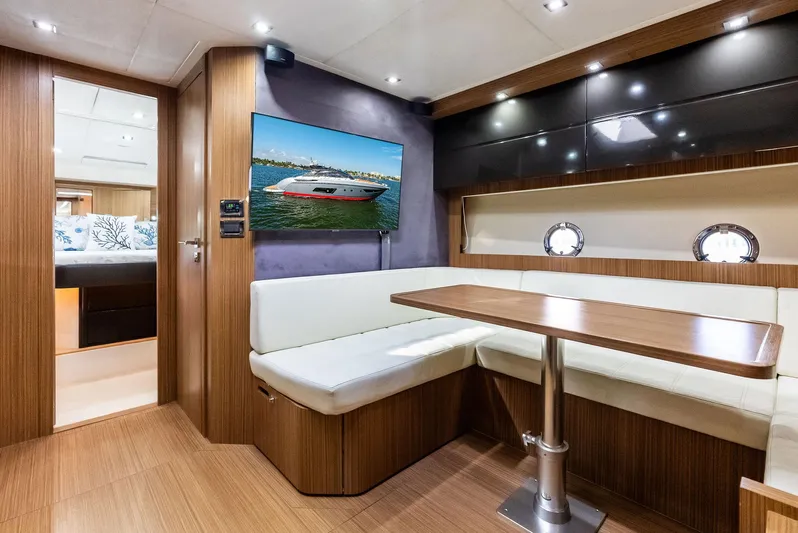 Po-sea-tive Vibez Yacht Photos Pics Luxurious interior of 2013 Azimut Atlantis 48 yacht with modern seating and table.