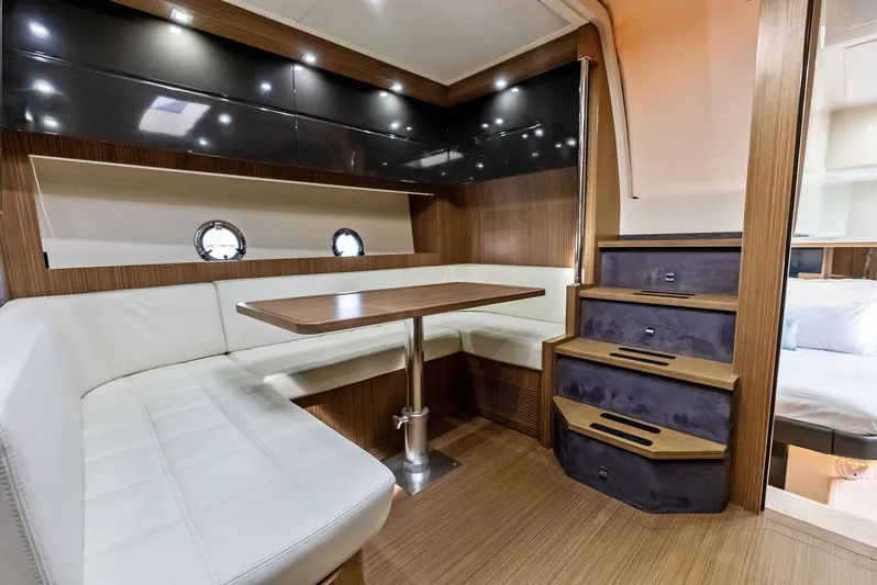 Po-sea-tive Vibez Yacht Photos Pics Luxurious interior of 2013 Azimut Atlantis 48 yacht with elegant seating and wooden finishes.