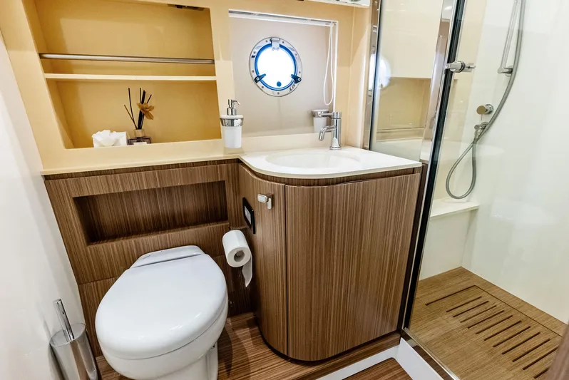 Po-sea-tive Vibez Yacht Photos Pics Luxurious bathroom in 2013 Azimut Atlantis 48 yacht with modern fixtures and wooden accents.
