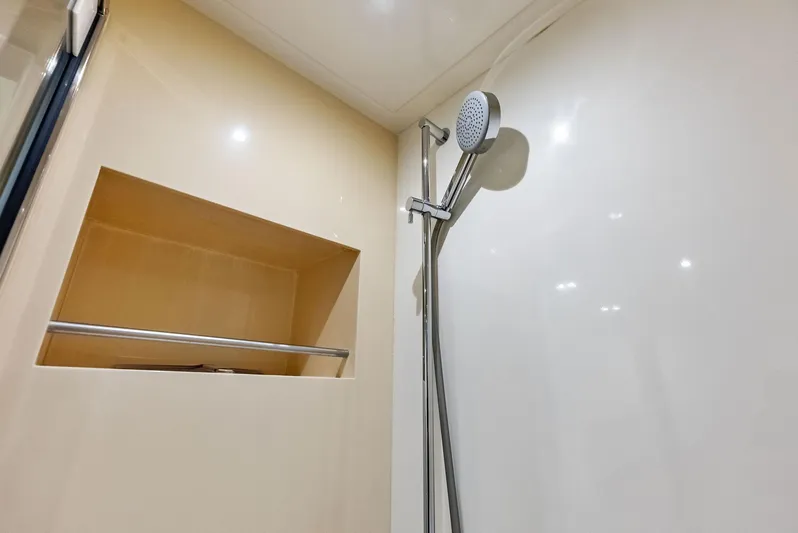 Po-sea-tive Vibez Yacht Photos Pics Shower area in 2013 Azimut Atlantis 48 yacht, featuring modern fixtures and storage.