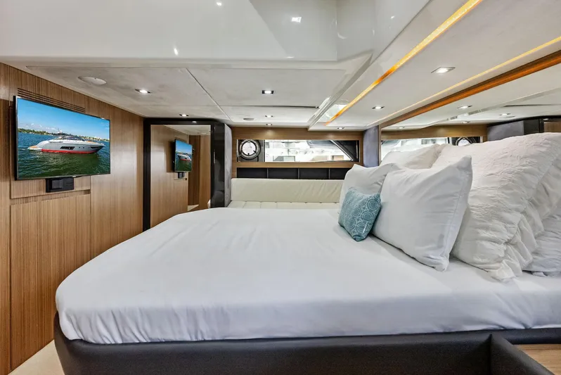 Po-sea-tive Vibez Yacht Photos Pics Luxurious bedroom interior of 2013 Azimut Atlantis 48 yacht with modern amenities.