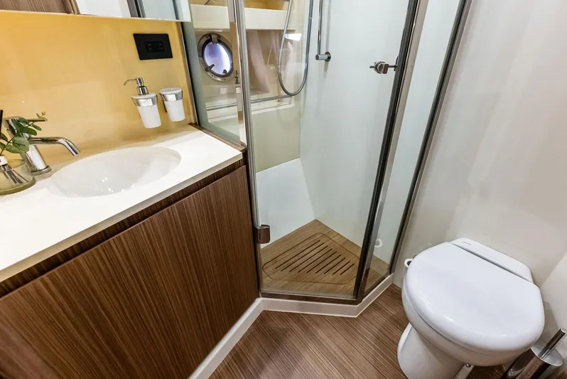 Po-sea-tive Vibez Yacht Photos Pics Luxurious bathroom in 2013 Azimut Atlantis 48 yacht with modern fixtures and wood accents.