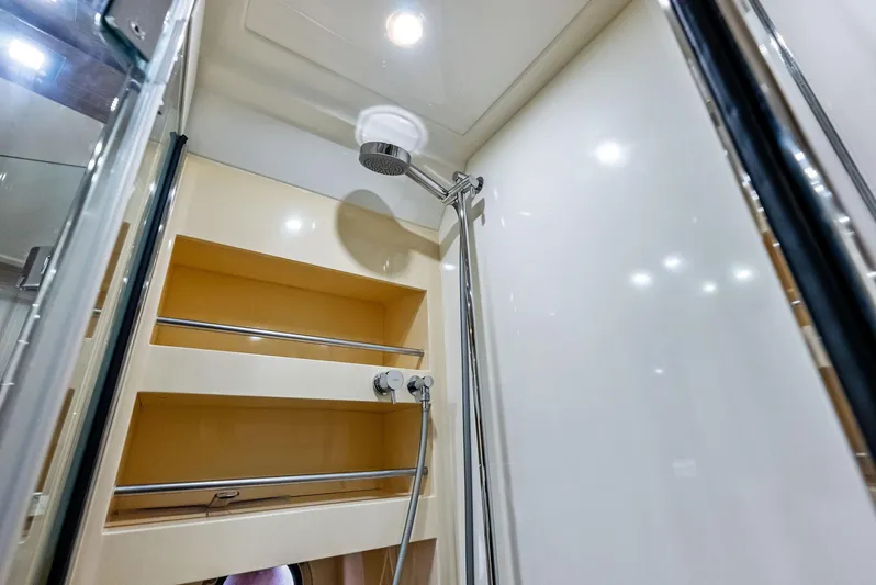 Po-sea-tive Vibez Yacht Photos Pics Azimut Atlantis 48 2013 yacht shower with modern fixtures and shelving.