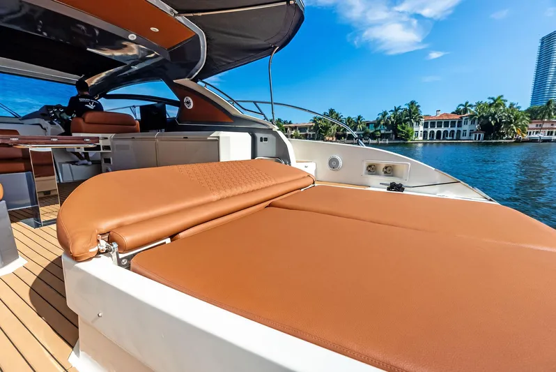 Po-sea-tive Vibez Yacht Photos Pics Luxurious 2013 Azimut Atlantis 48 yacht with spacious sun deck, docked by waterfront homes.