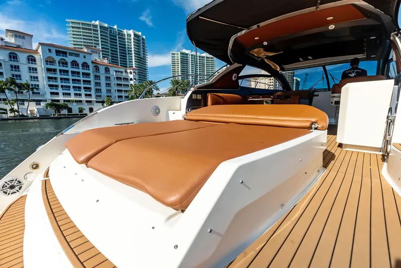 Po-sea-tive Vibez Yacht Photos Pics 2013 Azimut Atlantis 48 yacht with luxurious deck and cityscape background.