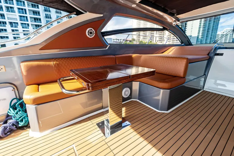 Po-sea-tive Vibez Yacht Photos Pics Luxurious 2013 Azimut Atlantis 48 yacht interior with elegant seating and wooden table.
