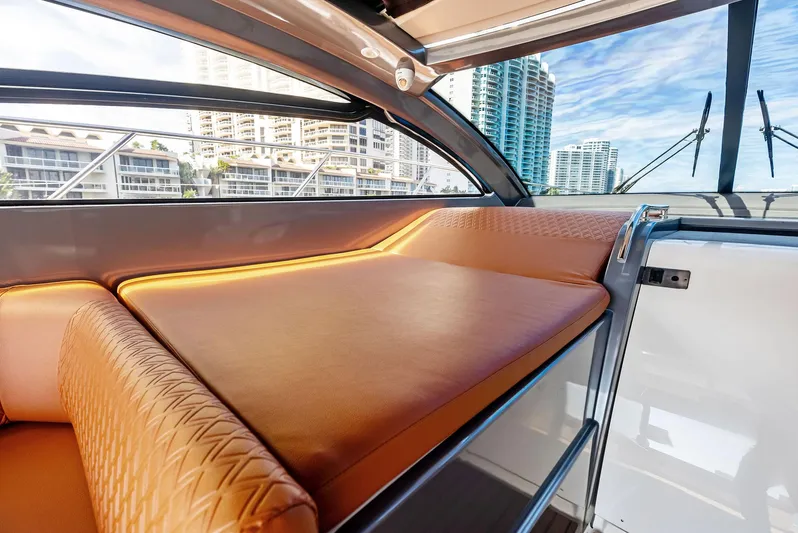 Po-sea-tive Vibez Yacht Photos Pics Luxurious interior of 2013 Azimut Atlantis 48 yacht with leather seating and cityscape view.