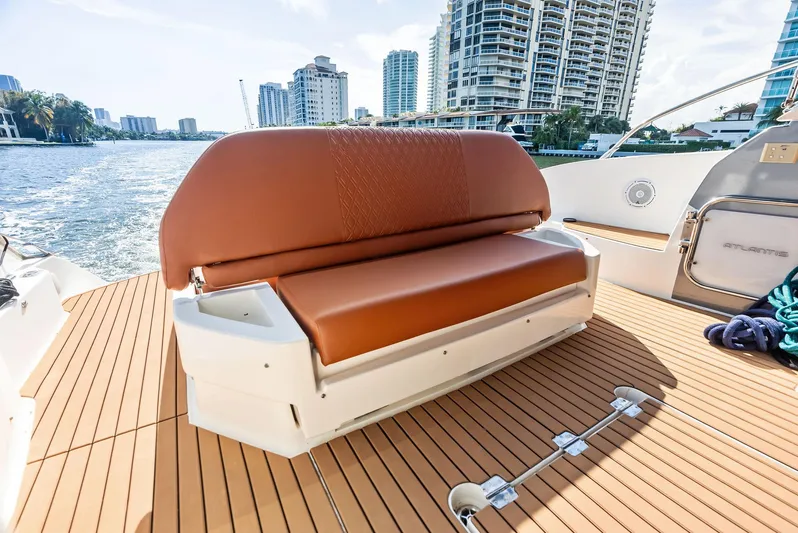 Po-sea-tive Vibez Yacht Photos Pics Azimut Atlantis 48 yacht deck with brown seating, cityscape in background, 2013 model.