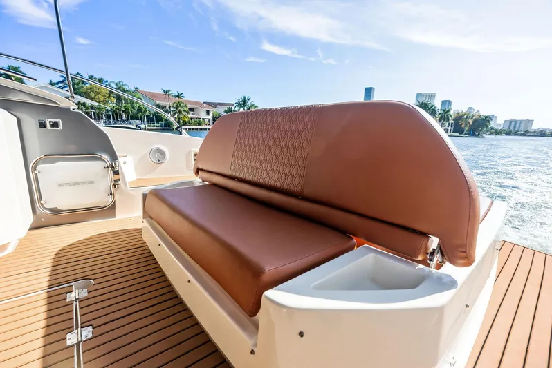 Po-sea-tive Vibez Yacht Photos Pics Luxurious seating on 2013 Azimut Atlantis 48 yacht, overlooking scenic waterfront.
