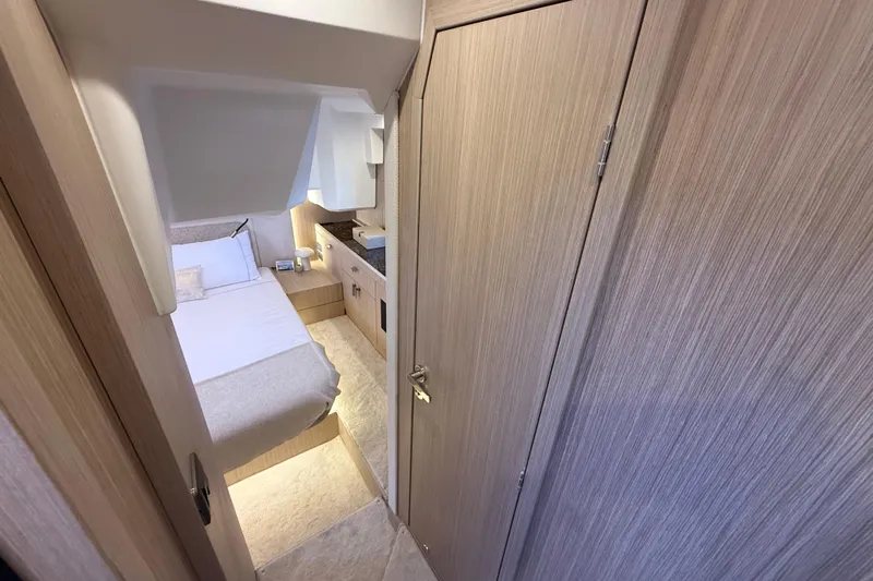  Yacht Photos Pics Luxurious cabin interior of 2026 Prestige F4.3 yacht, featuring cozy bed and modern design.