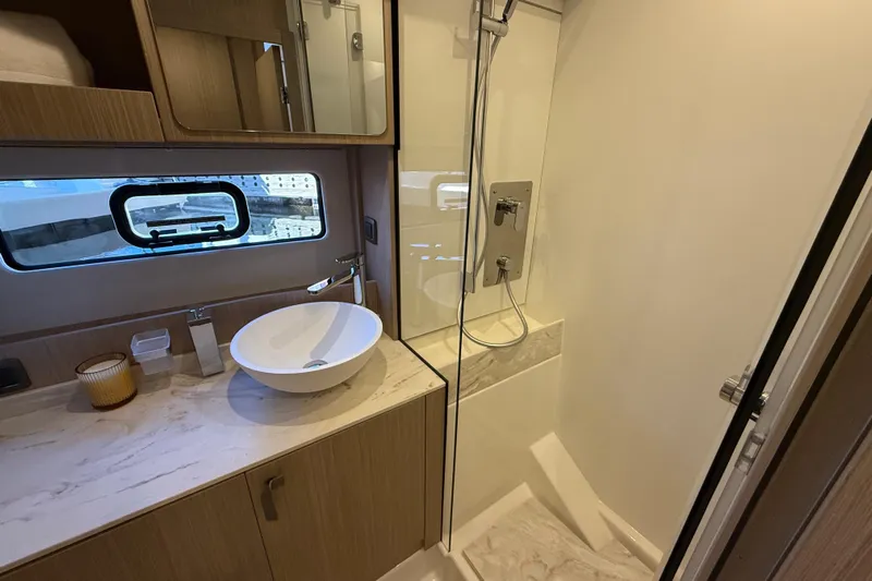  Yacht Photos Pics Modern bathroom in 2026 Prestige F4.3 yacht with sleek fixtures and elegant design.