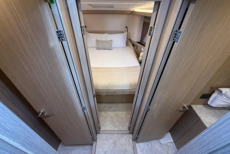  Yacht Photos Pics Luxurious cabin interior of 2026 Prestige F4.3 yacht, featuring elegant wood finishes.