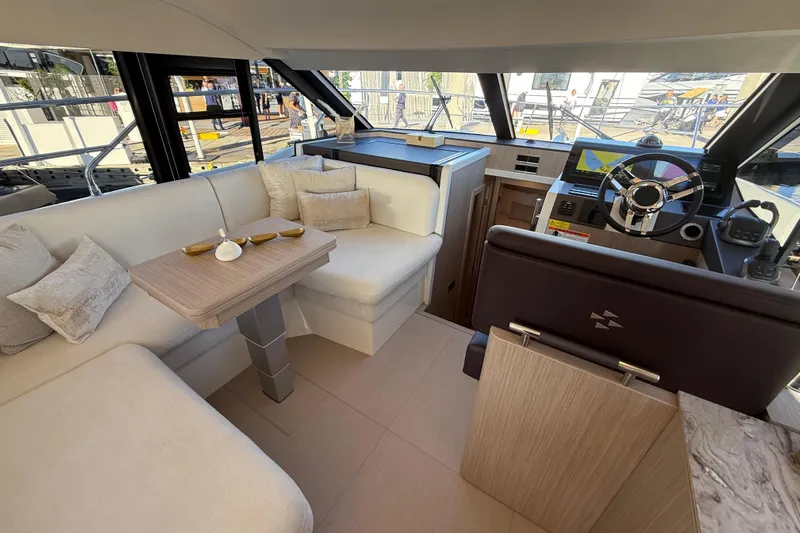  Yacht Photos Pics Luxurious interior of 2026 Prestige F4.3 yacht with modern helm and seating area.