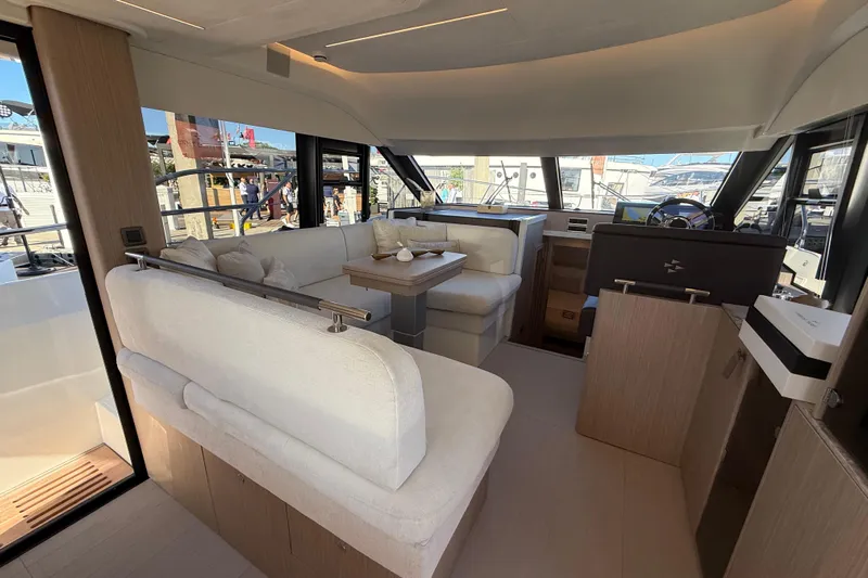  Yacht Photos Pics Luxurious interior of 2026 Prestige F4.3 yacht with modern seating and helm station.