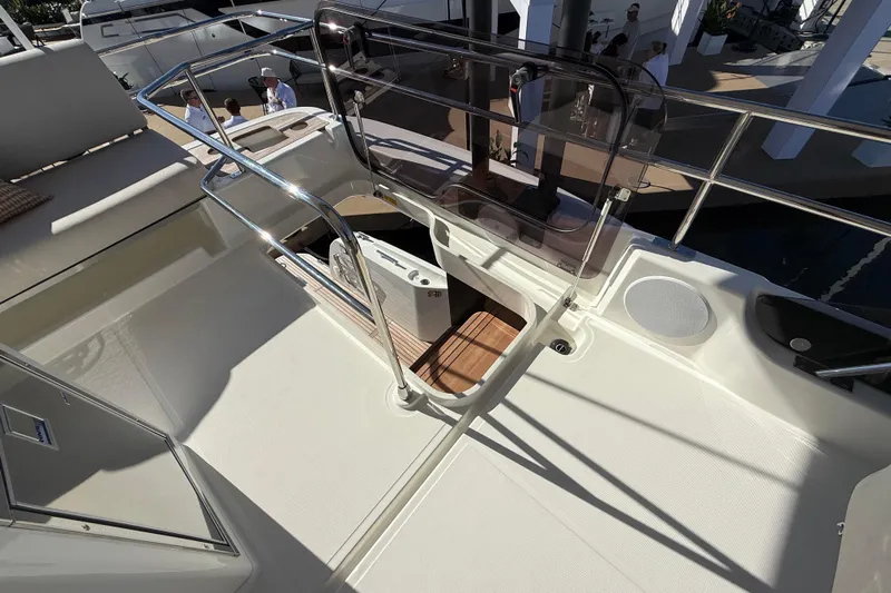  Yacht Photos Pics Modern Prestige F4.3 yacht deck, 2026 model, featuring sleek design and stainless steel railings.