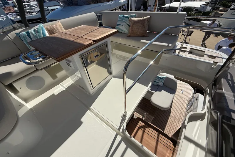  Yacht Photos Pics Luxurious 2026 Prestige F4.3 yacht interior with seating, table, and modern amenities.