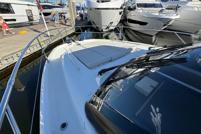  Yacht Photos Pics Prestige F4.3 yacht, 2026 model, docked at marina with sleek design and sunbathing area.