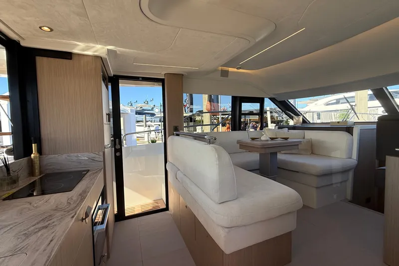  Yacht Photos Pics Luxurious interior of 2026 Prestige F4.3 yacht with modern seating and dining area.