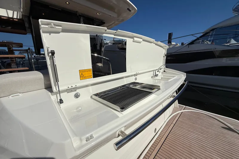  Yacht Photos Pics Outdoor kitchen on 2026 Prestige F4.3 yacht, featuring grill and sink.