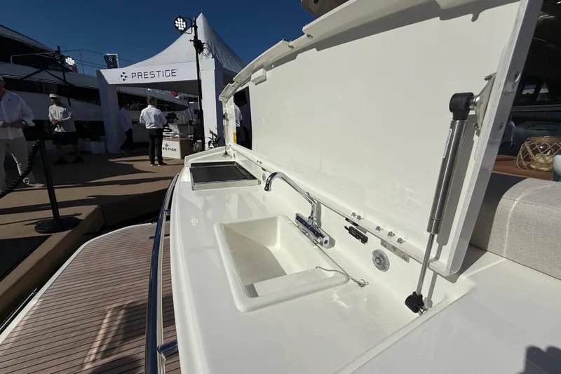  Yacht Photos Pics Prestige F4.3 2026 yacht with outdoor sink and grill at a boat show.