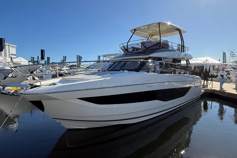  Yacht Photos Pics Luxury 2026 Prestige F4.3 yacht docked at marina under clear blue sky.