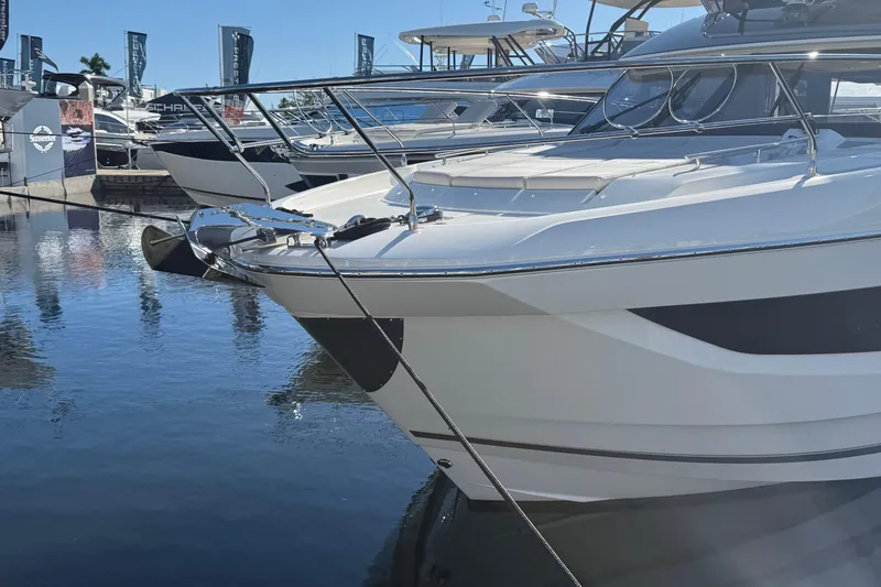  Yacht Photos Pics 2026 Prestige F4.3 yacht docked at marina, showcasing sleek design and modern features.