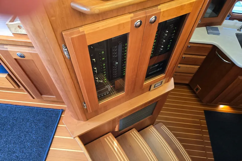 Grayson Yacht Photos Pics Interior of 2017 Sabre 48 Fly Bridge yacht with wooden cabinetry and control panels.