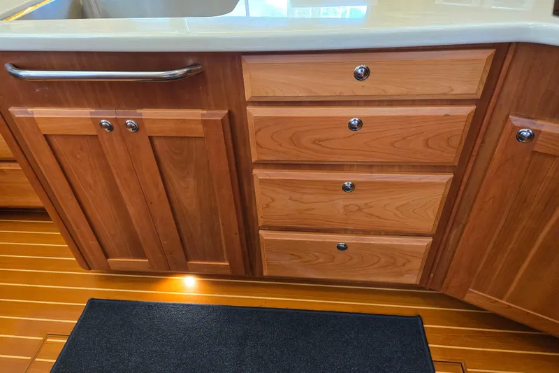 Grayson Yacht Photos Pics Wooden cabinetry and drawers in a 2017 Sabre 48 Fly Bridge yacht kitchen.