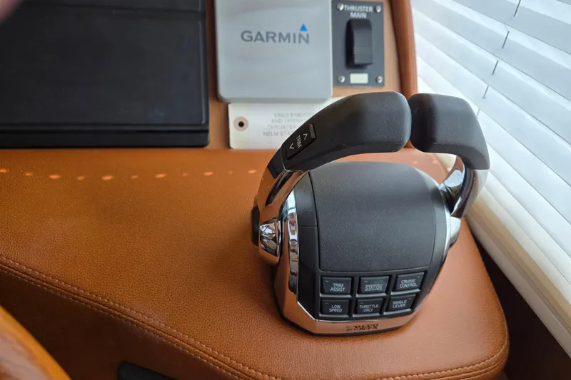 Grayson Yacht Photos Pics Throttle controls on 2017 Sabre 48 Fly Bridge yacht with Garmin navigation system.