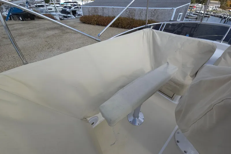 Grayson Yacht Photos Pics Flybridge seating area on 2017 Sabre 48 Fly Bridge yacht, covered in beige fabric.