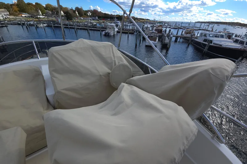 Grayson Yacht Photos Pics 2017 Sabre 48 Fly Bridge with covered seating at a marina.