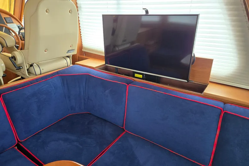 Grayson Yacht Photos Pics Interior of 2017 Sabre 48 Fly Bridge with blue seating and TV.